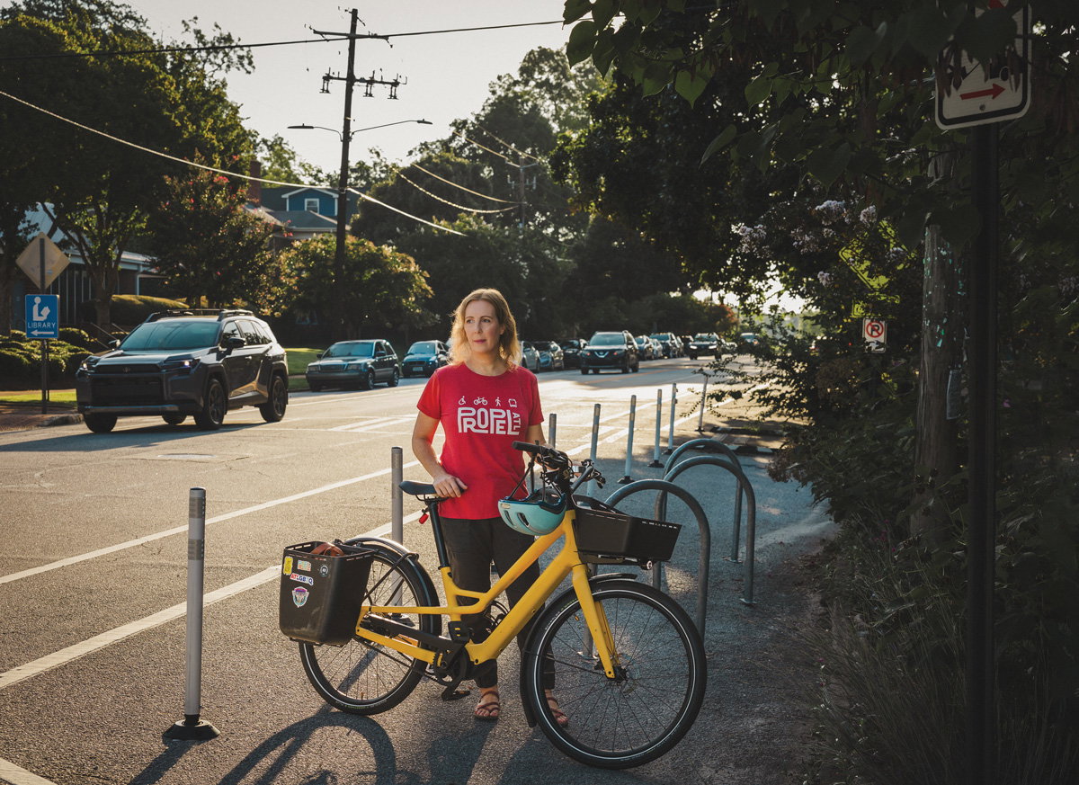 Rebecca Serna, executive director of Propel ATL, holds an e-bike