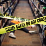 At this Decatur library, true crime lovers come together for Murder & Mocktails a person laid on the floor between two book isles is blocked off by yellow crime scene tape